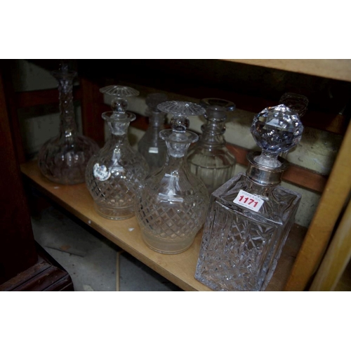 1171 - A silver mounted glass decanter and stopper; together with a pair of decanters and stoppers; and fou... 