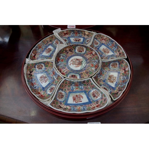 1200 - A Chinese Imari porcelain seven piece hors d'oeuvres set, in lacquer box and cover, 33cm diameter.&n... 