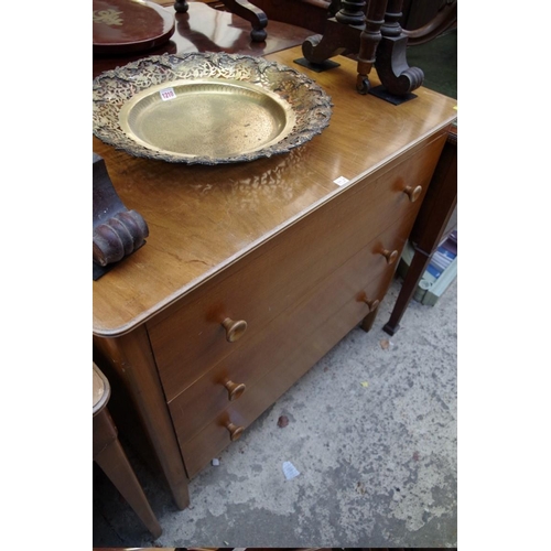 1207 - A 1950s Gordon Russell walnut dressing table and matching three drawer chest, 121cm wide and 91.5cm ... 