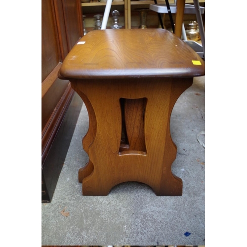 1208 - A nest of three Ercol elm tables, largest 57cm wide.