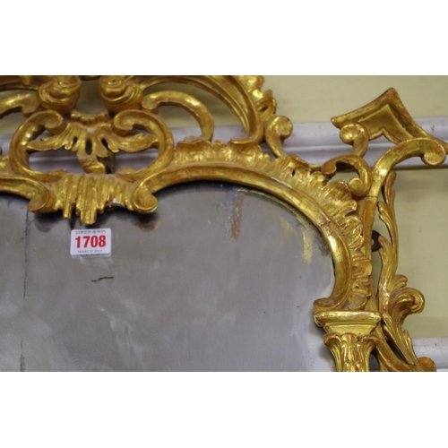 1708 - An 18th century carved and giltwood pier mirror, 97 x 57.5cm.