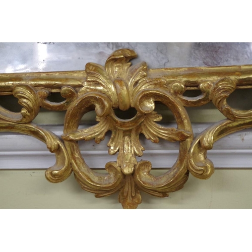 1708 - An 18th century carved and giltwood pier mirror, 97 x 57.5cm.