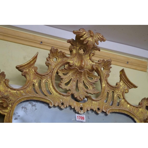 1709 - An 18th century carved and giltwood framed pier mirror, 112 x 64cm.