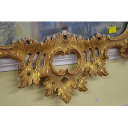 1709 - An 18th century carved and giltwood framed pier mirror, 112 x 64cm.