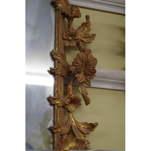 1709 - An 18th century carved and giltwood framed pier mirror, 112 x 64cm.