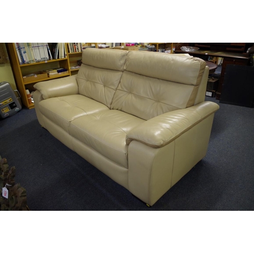 1721 - A modern oatmeal leather settee, 198cm wide. 