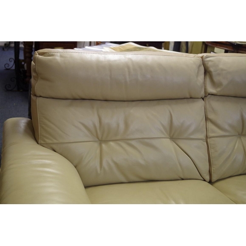 1721 - A modern oatmeal leather settee, 198cm wide. 