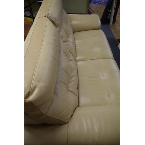 1721 - A modern oatmeal leather settee, 198cm wide. 