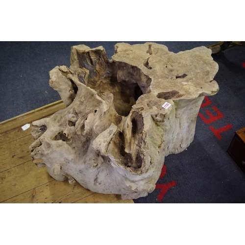 1725 - A weathered tree stump table base, 88cm wide.