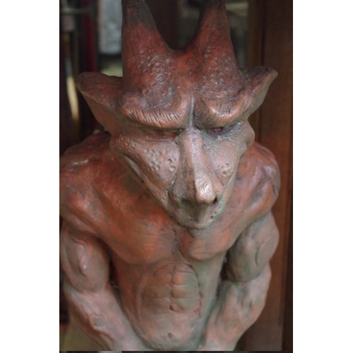 1740 - A roof ridge gable end tile, surmounted with a devil, 71cm high.