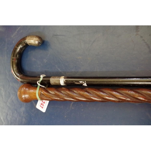 1747 - A silver mounted walking stick; together with an oak spiral reeded cane.