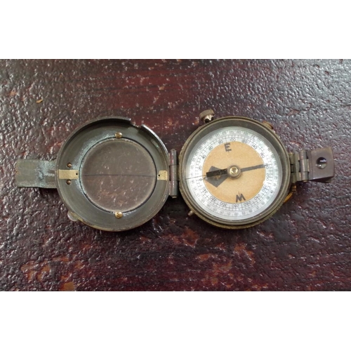 1760 - A World War I period brass pocket compass, in leather case; together with another item. ... 