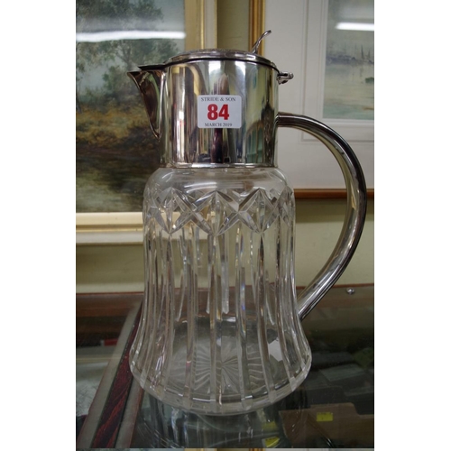 84 - A cut glass lemonade jug with silver plated mounts, 30cm.