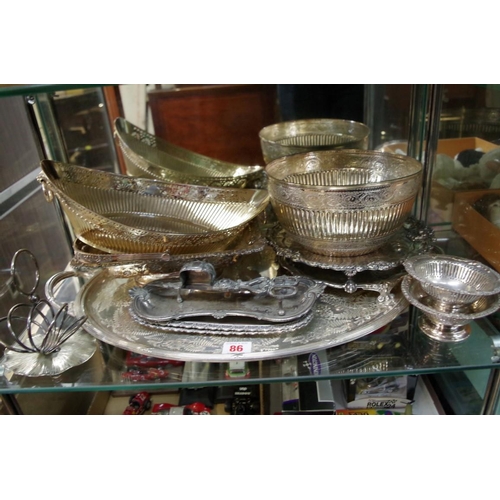 86 - An electroplated twin handled oval tray; together with other silver plated items.