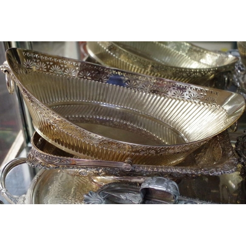 86 - An electroplated twin handled oval tray; together with other silver plated items.