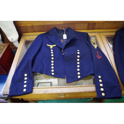 1754A - An original Kreigsmarine tunic, with four applied cloth badges.