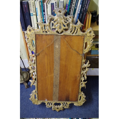 1709 - An 18th century carved and giltwood framed pier mirror, 112 x 64cm.