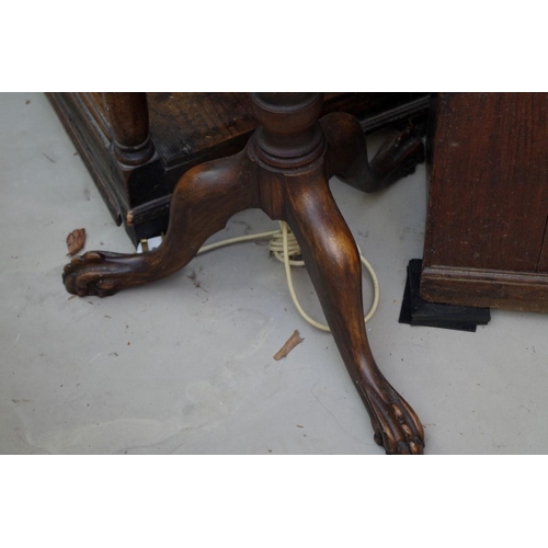 1114 - An Edwardian carved mahogany tripod standard lamp.  