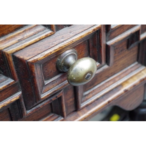 1119 - An 18th century oak dresser base, with geometrically moulded frieze drawers above reel turned legs j... 