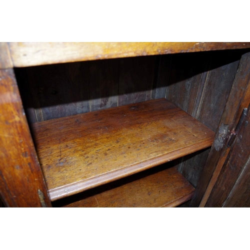 1165 - An 18th century Continental panelled oak single door cupboard, 80cm wide. ... 