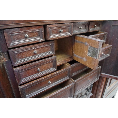 1166 - A late 17th century and later oak cabinet on stand, with geometric moulding and ebonized detail, 89c... 