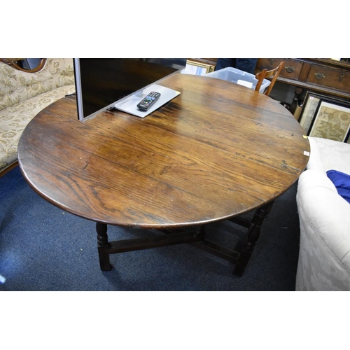 1737 - An early 18th century oak gateleg table, with lateral frieze drawer, 146cm wide when open.... 