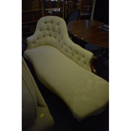 1738 - A Victorian rosewood and button upholstered chaise longue, with ivory damask fabric.... 