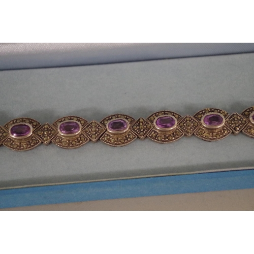 204 - An amethyst and marcasite bracelet, stamped .925; together with a rectangular marcasite brooch and a... 