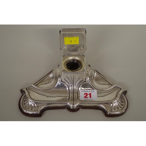 21 - An Art Nouveau silver inkstand, by William Neale, Birmingham 1911, mounted on wooden base, 20cm.... 