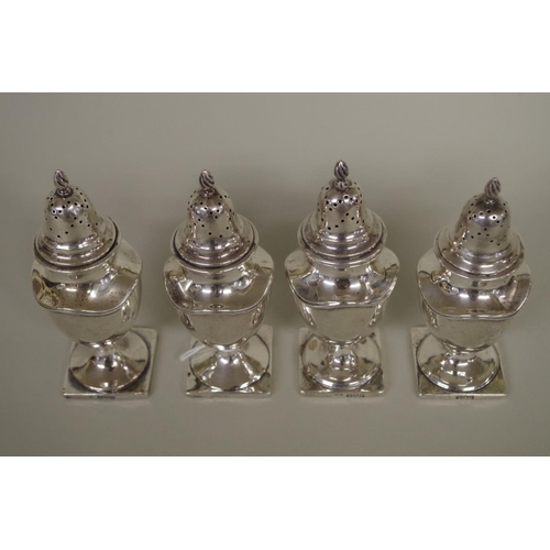 29 - Four silver pepperettes, one by Goldsmiths & Silversmiths Co, London 1906; the other t... 