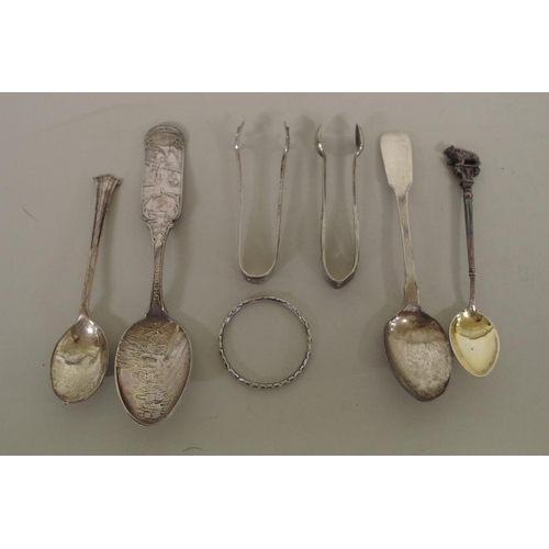 65 - A selection of silver and other metal items; to include spoons; sugar tongs etc.