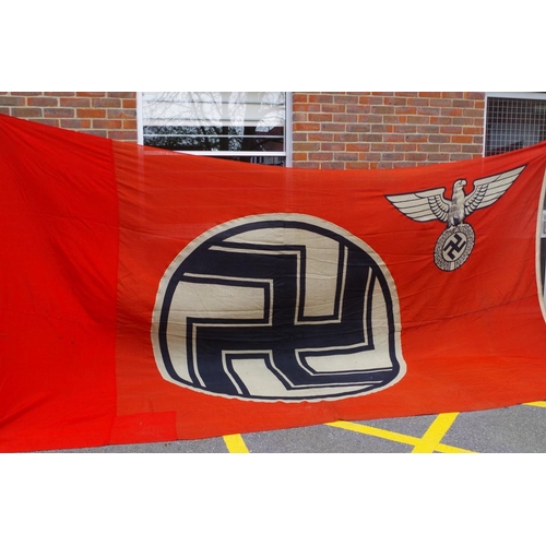 1728 - A German Third Reich large Swastika flag, 290 x 490cm, (the left hand side is slightly different col... 