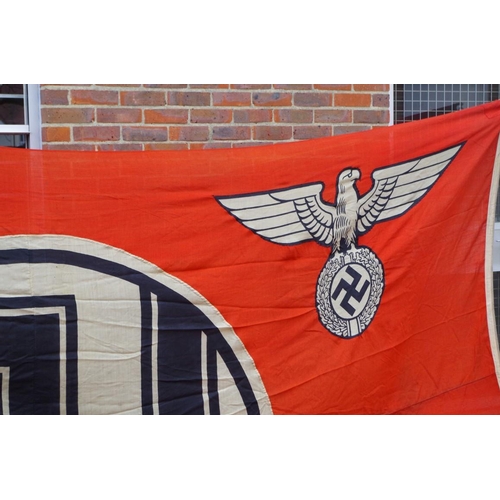 1728 - A German Third Reich large Swastika flag, 290 x 490cm, (the left hand side is slightly different col... 