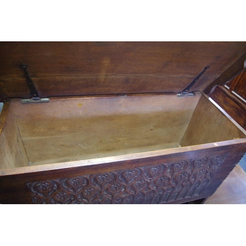 1691 - A carved oak boarded coffer, 101cm wide. 