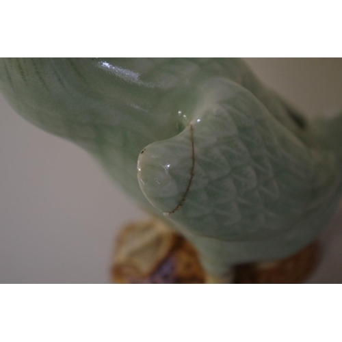 550 - Four Chinese celadon glazed geese, largest 23.5cm. (4)