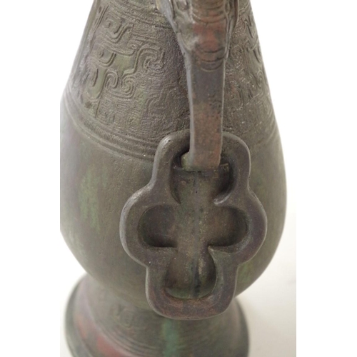 560 - A Chinese Archaistic bronze style twin handled vase, probably Ming or earlier, 29.5cm high.... 