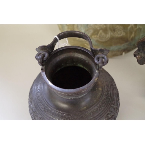 565 - A group of Chinese Archaistic style bronzes, comprising: a large twin handled tripod censer and cove... 