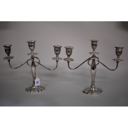 18 - A pair of silver twin branch candelabra, by Alexander Smith, Birmingham 1976, 27.5cm high.... 