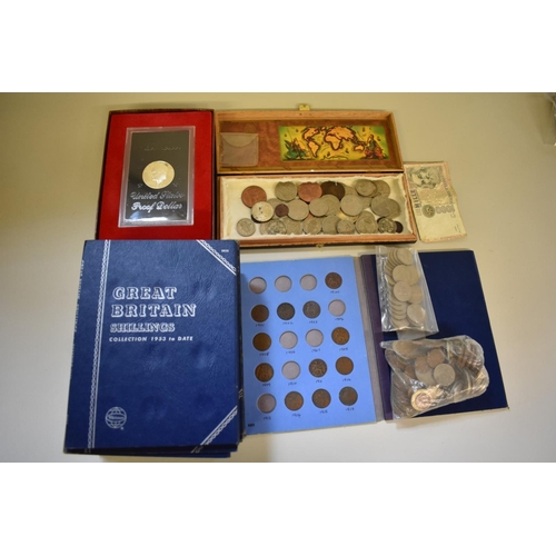 281 - A quantity of coins to include an Eisenhower 1971 proof dollar.