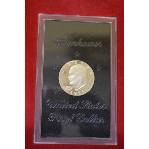 281 - A quantity of coins to include an Eisenhower 1971 proof dollar.