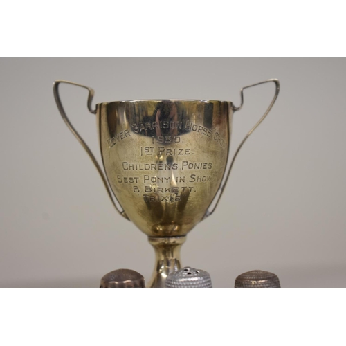 66 - A small silver trophy cup; together with other silver and metal items.