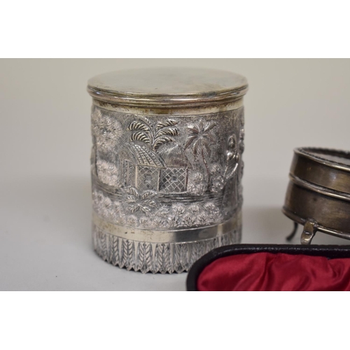 68 - Four items of silver, to include: a cased souvenir spoon; a silver and tortoiseshell casket; a napki... 