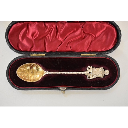 68 - Four items of silver, to include: a cased souvenir spoon; a silver and tortoiseshell casket; a napki... 