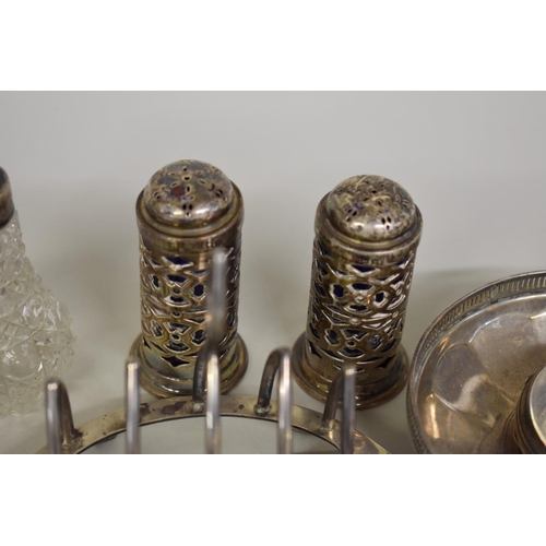 79 - A small collection of silver and metal items, to include: a toast rack; a mustard; a fob watch; and ... 