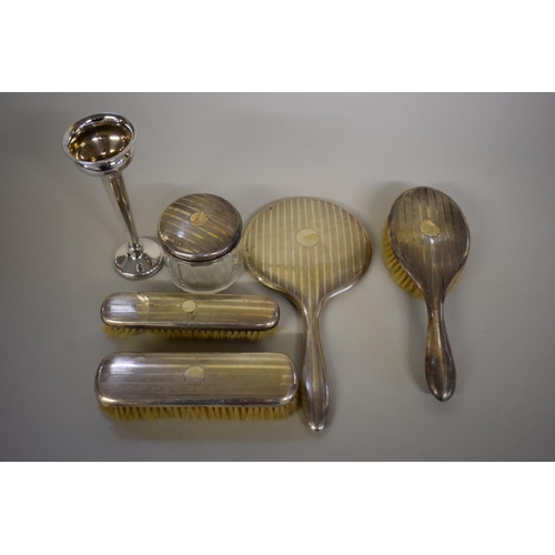 80 - A Continental silver engine turned five piece dressing table set; together with a silver trumpet vas... 