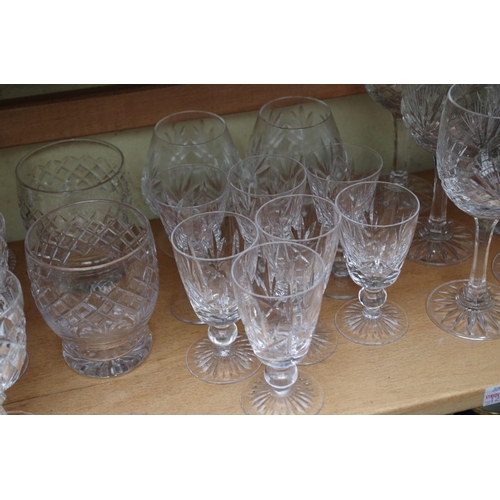 1231 - A collection of English drinking glasses, to include examples by Stuart. (two shelves)... 