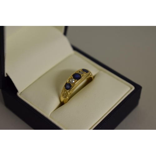 274 - An 18ct gold sapphire and diamond gypsy ring.