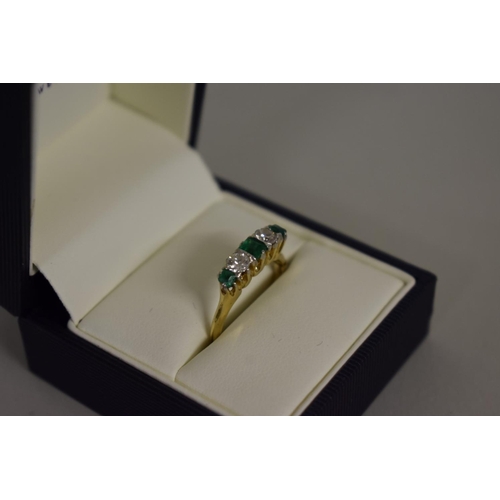 277 - A emerald and diamond five stone gold ring, hallmarked 18ct.... 