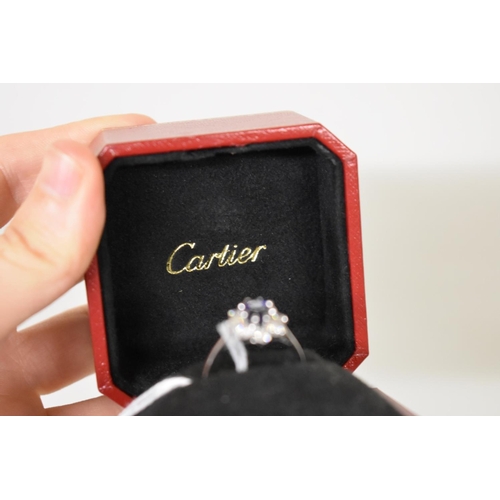 279 - A Cartier oval sapphire and diamond high carat white gold ring, boxed.