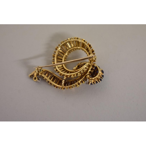 290 - A gold, diamond and sapphire swirl brooch, hallmarked 18ct, 1964, 4cm width, 12g all in.... 
